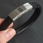 Memorial ashes captured on a braided black leather bracelet