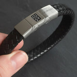 Memorial ashes captured on a braided black leather bracelet