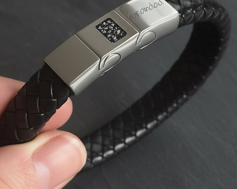Memorial ashes captured on a braided black leather bracelet