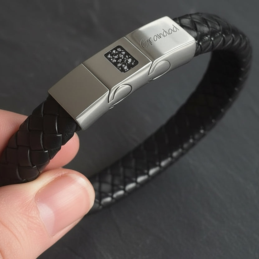 Memorial ashes captured on a braided black leather bracelet