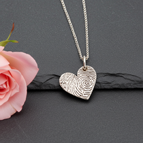 Heart-shaped fingerprint pendant on a chain