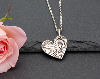Heart-shaped fingerprint pendant on a chain