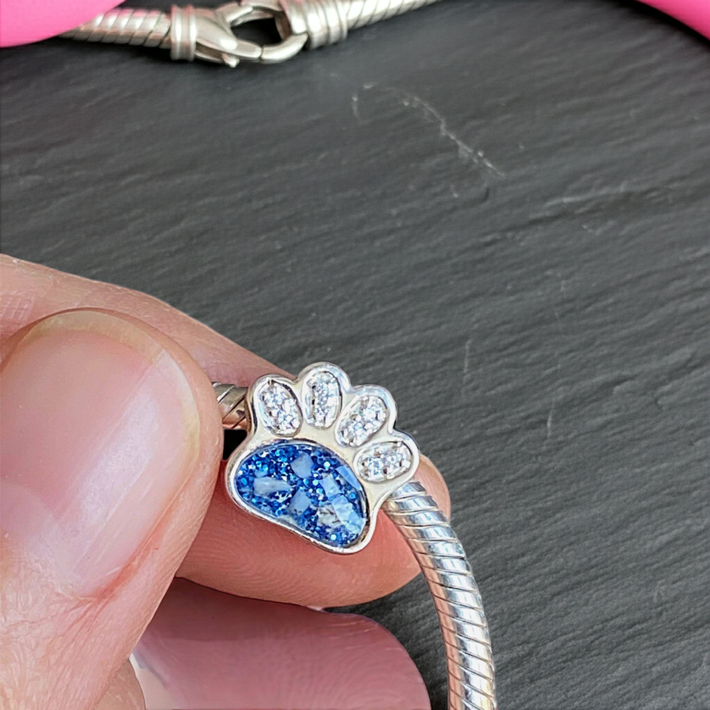 Silver bracelet with memorial ashes paw-shaped charm