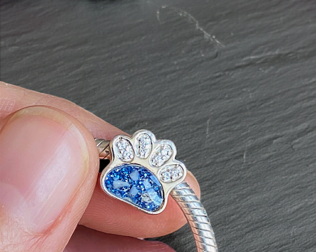 Silver bracelet with memorial ashes paw-shaped charm