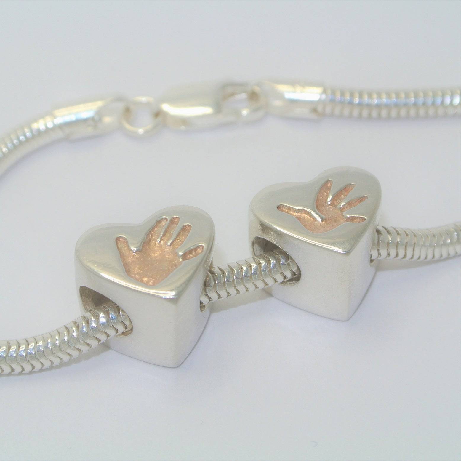 handprint bracelet, footprint necklace, baby handprint, child handprint, hand print bracelet, personalised bracelet, silver handprint jewellery, from the heart jewellery, baby footprint, footprint bracelet, child footprint, silver and rose gold handprint jewellery, rose gold handprint bracelet, handprint heart bead