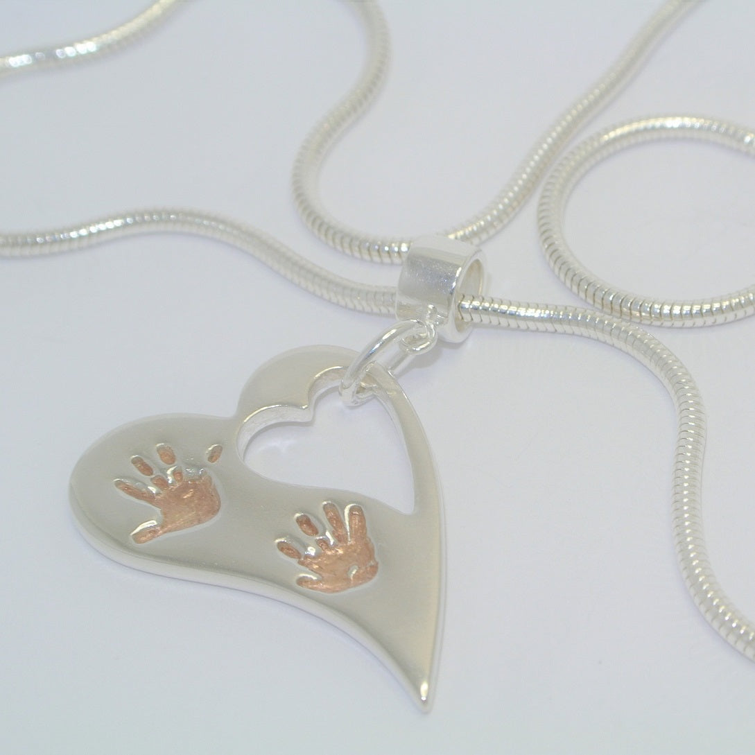 handprint necklace, footprint necklace, baby handprint, child handprint, hand print necklace, personalised necklace, silver handprint jewellery, from the heart jewellery, baby footprint, footprint necklace, child footprint, handprints silver and rose gold necklace, handprint rose gold necklace