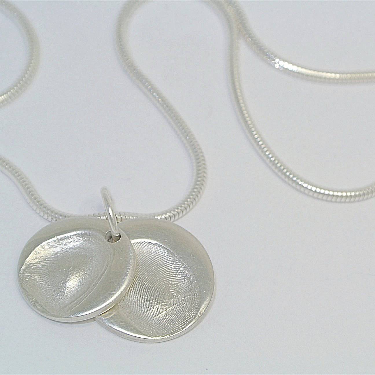 Descending Duo circle Sterling Silver Fingerprint Jewellery, baby fingerprint jewellery, baby fingerprint necklace, child fingerprint necklace, hand print jewellery, childrens fingerprint jewellery, personalised fingerprint jewellery, personalised fingerprint bracelet, personalised handprint jewellery, silver handprint jewellery, handprint necklace uk, from the heart jewellery, baby print jewellery, personalised silver jewellery