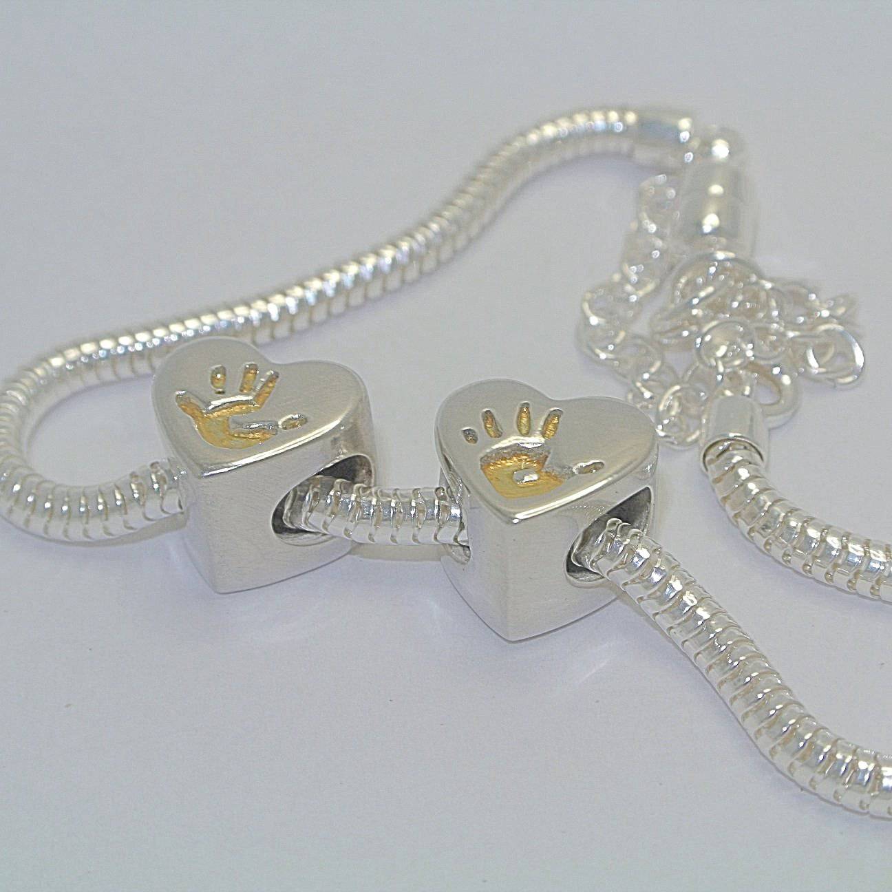 handprint bracelet, footprint necklace, baby handprint, child handprint, hand print bracelet, personalised bracelet, silver handprint jewellery, from the heart jewellery, baby footprint, footprint bracelet, child footprint, silver and gold handprint jewellery, gold hadnprint bracelet, handprint heart bead