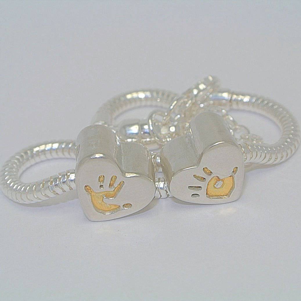 handprint bracelet, footprint necklace, baby handprint, child handprint, hand print bracelet, personalised bracelet, silver handprint jewellery, from the heart jewellery, baby footprint, footprint bracelet, child footprint, silver and gold handprint jewellery, gold hadnprint bracelet, handprint heart bead